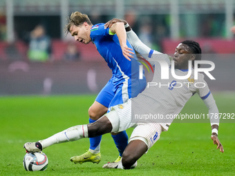 Manu Kone' of France and Nicolo' Barella of Italy compete for the ball during the UEFA Nations League 2024/25 League A Group 2 match between...