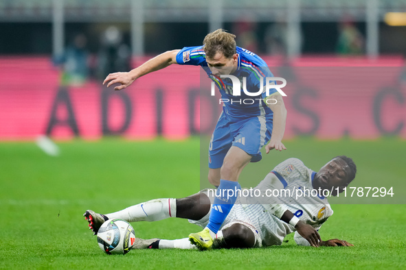 Manu Kone' of France and Nicolo' Barella of Italy compete for the ball during the UEFA Nations League 2024/25 League A Group 2 match between...