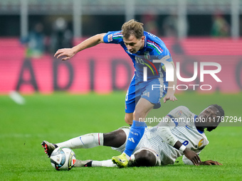 Manu Kone' of France and Nicolo' Barella of Italy compete for the ball during the UEFA Nations League 2024/25 League A Group 2 match between...