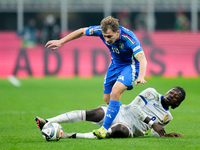 Manu Kone' of France and Nicolo' Barella of Italy compete for the ball during the UEFA Nations League 2024/25 League A Group 2 match between...