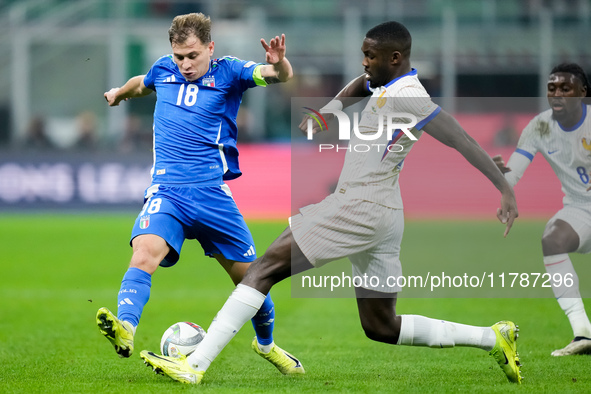 Marcus Thuram of France and Nicolo' Barella of Italy compete for the ball during the UEFA Nations League 2024/25 League A Group 2 match betw...