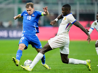 Marcus Thuram of France and Nicolo' Barella of Italy compete for the ball during the UEFA Nations League 2024/25 League A Group 2 match betw...