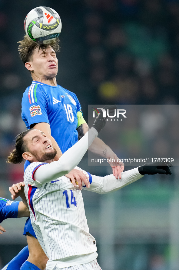 Nicolo' Barella of Italy and Adrien Rabiot of France jump for the ball during the UEFA Nations League 2024/25 League A Group 2 match between...