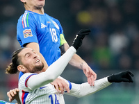 Nicolo' Barella of Italy and Adrien Rabiot of France jump for the ball during the UEFA Nations League 2024/25 League A Group 2 match between...