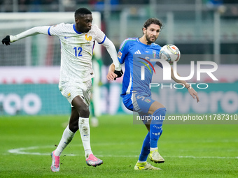 Randal Kolo Muani of France and Manuel Locatelli of Italy compete for the ball during the UEFA Nations League 2024/25 League A Group 2 match...