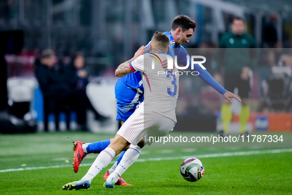 Andrea Cambiaso of Italy and Lucas Digne of France compete for the ball during the UEFA Nations League 2024/25 League A Group 2 match betwee...