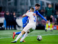 Andrea Cambiaso of Italy and Lucas Digne of France compete for the ball during the UEFA Nations League 2024/25 League A Group 2 match betwee...