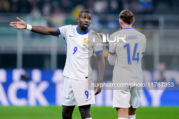 Marcus Thuram of France talks to Adrien Rabiot of France during the UEFA Nations League 2024/25 League A Group 2 match between Italy and Fra...