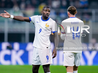 Marcus Thuram of France talks to Adrien Rabiot of France during the UEFA Nations League 2024/25 League A Group 2 match between Italy and Fra...