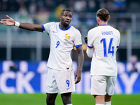 Marcus Thuram of France talks to Adrien Rabiot of France during the UEFA Nations League 2024/25 League A Group 2 match between Italy and Fra...