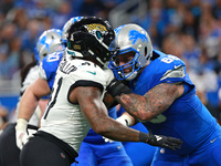 DETROIT,MICHIGAN-November 17: Detroit Lions offensive tackle Taylor Decker (68) defends against Jacksonville Jaguars defensive end Josh Hine...