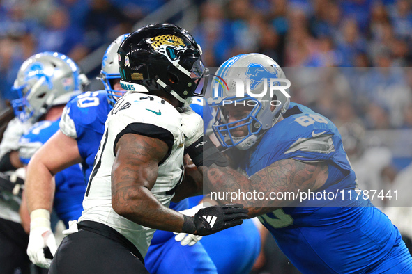 DETROIT,MICHIGAN-November 17: Detroit Lions offensive tackle Taylor Decker (68) defends against Jacksonville Jaguars defensive end Josh Hine...