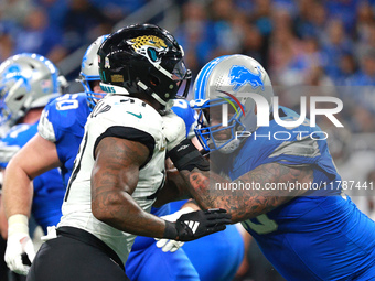 DETROIT,MICHIGAN-November 17: Detroit Lions offensive tackle Taylor Decker (68) defends against Jacksonville Jaguars defensive end Josh Hine...