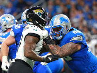 DETROIT,MICHIGAN-November 17: Detroit Lions offensive tackle Taylor Decker (68) defends against Jacksonville Jaguars defensive end Josh Hine...