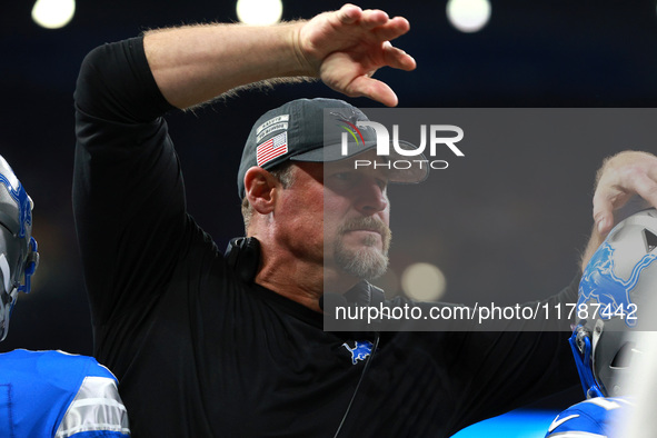 DETROIT,MICHIGAN-November 17: Detroit Lions head coach Dan Campbell celebrates with players after a touchdown during the second half of an N...