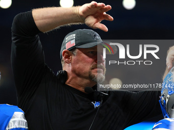 DETROIT,MICHIGAN-November 17: Detroit Lions head coach Dan Campbell celebrates with players after a touchdown during the second half of an N...