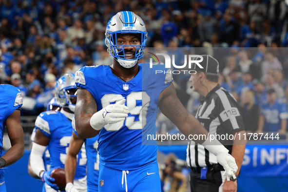 DETROIT,MICHIGAN-November 17: Detroit Lions defensive end Za'Darius Smith (99) celebrates after an interception by safety Kerby Joseph (31)...