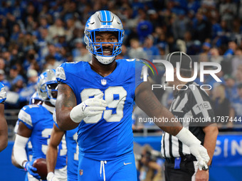 DETROIT,MICHIGAN-November 17: Detroit Lions defensive end Za'Darius Smith (99) celebrates after an interception by safety Kerby Joseph (31)...