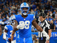 DETROIT,MICHIGAN-November 17: Detroit Lions defensive end Za'Darius Smith (99) celebrates after an interception by safety Kerby Joseph (31)...