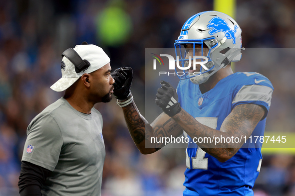 DETROIT,MICHIGAN-NOVEMBER17:  Wide receiver Tim Patrick (17) of the Detroit Lions communicates with a coach between plays during a game betw...