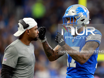 DETROIT,MICHIGAN-NOVEMBER17:  Wide receiver Tim Patrick (17) of the Detroit Lions communicates with a coach between plays during a game betw...