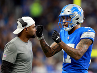 DETROIT,MICHIGAN-NOVEMBER17:  Wide receiver Tim Patrick (17) of the Detroit Lions communicates with a coach between plays during a game betw...