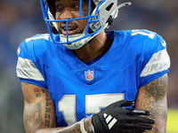 DETROIT,MICHIGAN-NOVEMBER17:  Wide receiver Tim Patrick (17) of the Detroit Lions communicates with a coach between plays during a game betw...