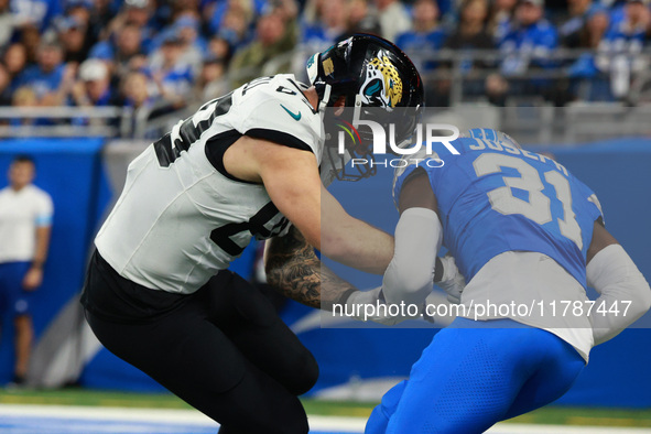 DETROIT,MICHIGAN-November 17: Detroit Lions safety Kerby Joseph (31) intercepts a pass intended for Jacksonville Jaguars tight end Luke Farr...