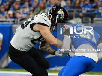 DETROIT,MICHIGAN-November 17: Detroit Lions safety Kerby Joseph (31) intercepts a pass intended for Jacksonville Jaguars tight end Luke Farr...