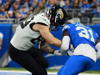 DETROIT,MICHIGAN-November 17: Detroit Lions safety Kerby Joseph (31) intercepts a pass intended for Jacksonville Jaguars tight end Luke Farr...