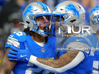 DETROIT,MICHIGAN-NOVEMBER17:  Running back Jahmyr Gibbs (26) of the Detroit Lions celebrates a touchdown with running back David Montgomery...