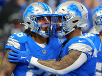 DETROIT,MICHIGAN-NOVEMBER17:  Running back Jahmyr Gibbs (26) of the Detroit Lions celebrates a touchdown with running back David Montgomery...