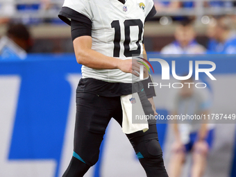 DETROIT,MICHIGAN-NOVEMBER17:  Quarterback Mac Jones (10) of the Jacksonville Jaguars walks on the field during a game between the Detroit Li...