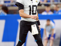 DETROIT,MICHIGAN-NOVEMBER17:  Quarterback Mac Jones (10) of the Jacksonville Jaguars walks on the field during a game between the Detroit Li...