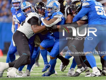 DETROIT,MICHIGAN-NOVEMBER17:  Running back David Montgomery (5) of the Detroit Lions carries the ball during a game between the Detroit Lion...