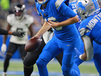 DETROIT,MICHIGAN-November 17: Detroit Lions quarterback Jared Goff (16) looks to pass during the second half of an NFL football game between...