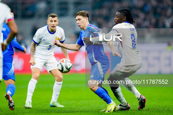 Manu Kone' of France and Nicolo' Barella of Italy compete for the ball during the UEFA Nations League 2024/25 League A Group 2 match between...