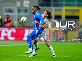 Destiny Udogie of Italy and Matteo Guendouzi of France compete for the ball during the UEFA Nations League 2024/25 League A Group 2 match be...