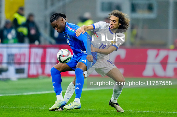 Destiny Udogie of Italy and Matteo Guendouzi of France compete for the ball during the UEFA Nations League 2024/25 League A Group 2 match be...