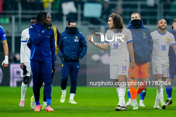 Caleb Okoli of Italy argues with Matteo Guendouzi of France at the end of the UEFA Nations League 2024/25 League A Group 2 match between Ita...