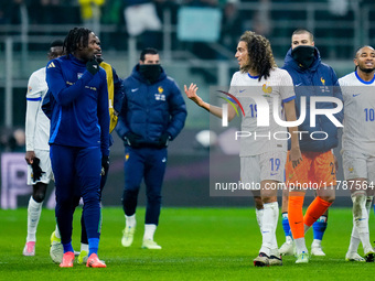 Caleb Okoli of Italy argues with Matteo Guendouzi of France at the end of the UEFA Nations League 2024/25 League A Group 2 match between Ita...