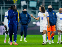 Caleb Okoli of Italy argues with Matteo Guendouzi of France at the end of the UEFA Nations League 2024/25 League A Group 2 match between Ita...