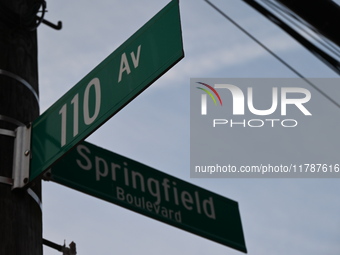 Street signage is at the scene in Queens Village, New York, United States, on November 17, 2024. One person is killed in a fire that affects...