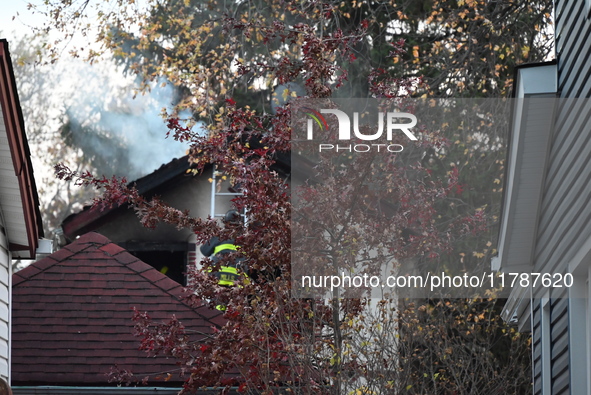 Flames come from the home on Sunday afternoon in Queens Village. One person is killed in a fire that affects a residence at 218-59 110th Ave...