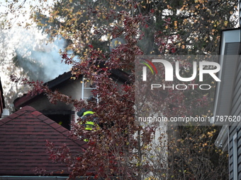 Flames come from the home on Sunday afternoon in Queens Village. One person is killed in a fire that affects a residence at 218-59 110th Ave...