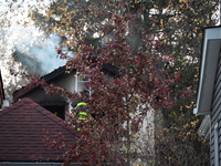 Flames come from the home on Sunday afternoon in Queens Village. One person is killed in a fire that affects a residence at 218-59 110th Ave...