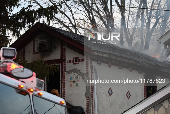 Flames come from the home on Sunday afternoon in Queens Village. One person is killed in a fire that affects a residence at 218-59 110th Ave...