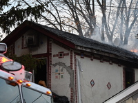 Flames come from the home on Sunday afternoon in Queens Village. One person is killed in a fire that affects a residence at 218-59 110th Ave...