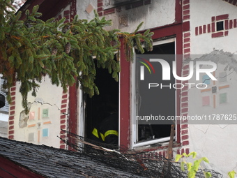 Flames come from the home on Sunday afternoon in Queens Village. One person is killed in a fire that affects a residence at 218-59 110th Ave...