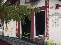 Flames come from the home on Sunday afternoon in Queens Village. One person is killed in a fire that affects a residence at 218-59 110th Ave...